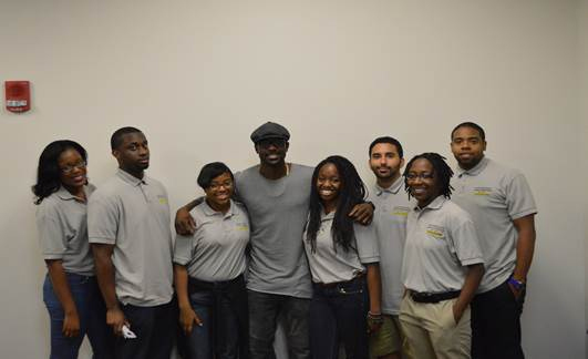 Lance Gross posing with Savannah State University students after a panel discussion.